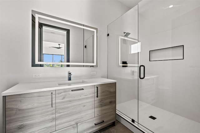 bathroom with vanity and a shower with door