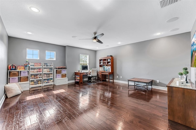 office area featuring dark wood-type flooring and ceiling fan