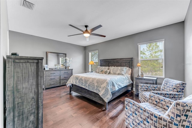 bedroom with hardwood / wood-style floors and ceiling fan