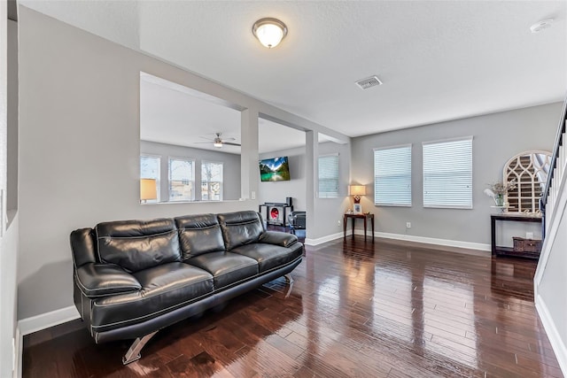 living room featuring hardwood / wood-style floors and a textured ceiling