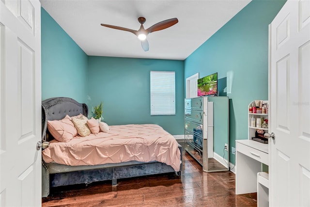 bedroom featuring dark hardwood / wood-style floors and ceiling fan