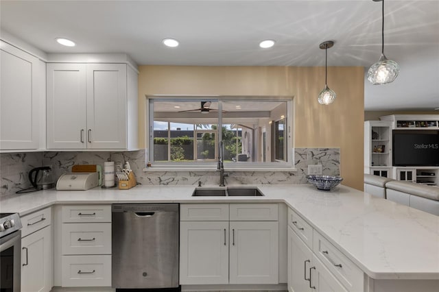 kitchen with pendant lighting, sink, white cabinetry, stainless steel appliances, and kitchen peninsula