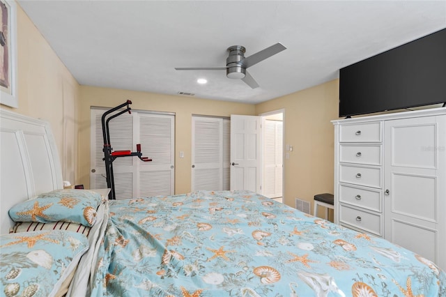 bedroom with multiple closets and ceiling fan