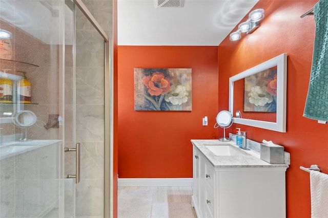 bathroom featuring walk in shower and vanity