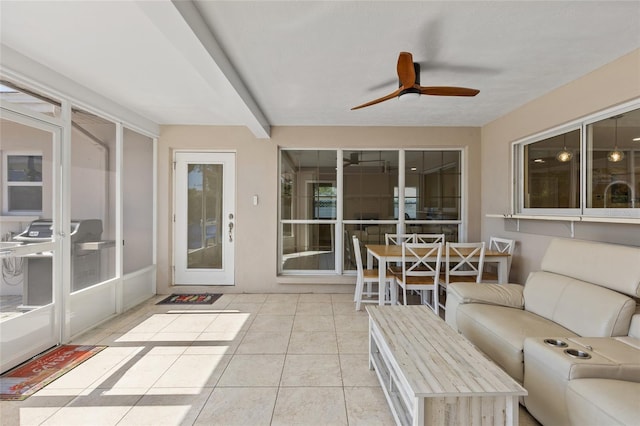 sunroom with ceiling fan and french doors