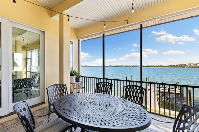 sunroom with a water view