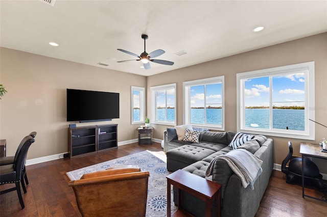 living room with dark hardwood / wood-style floors and ceiling fan