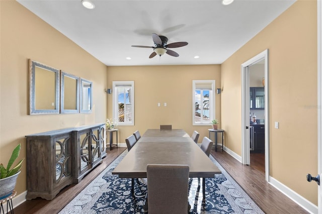 dining room with dark hardwood / wood-style floors and ceiling fan