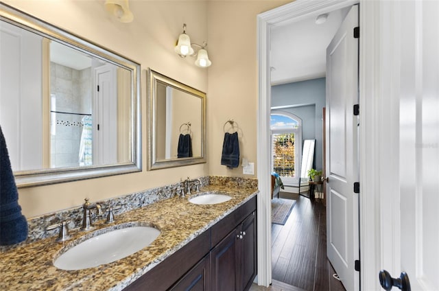 bathroom with vanity and hardwood / wood-style floors