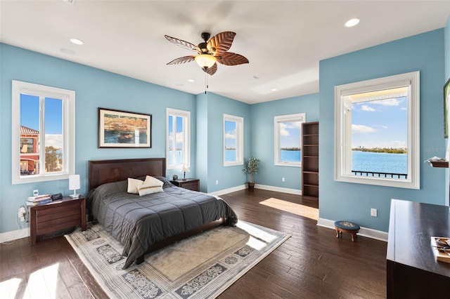 bedroom featuring dark wood-type flooring and ceiling fan