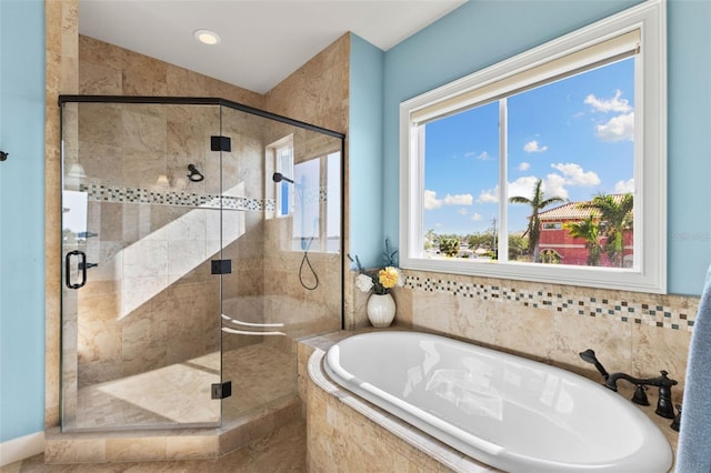 bathroom with shower with separate bathtub