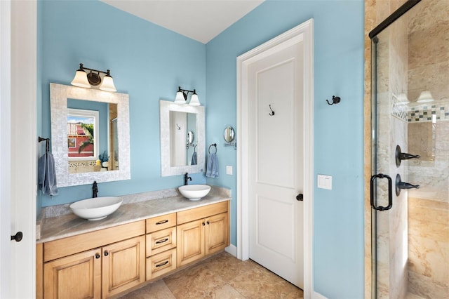 bathroom featuring an enclosed shower, vanity, and tile patterned floors