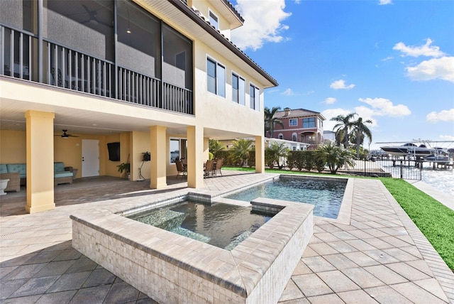 view of swimming pool with a patio, an in ground hot tub, and ceiling fan