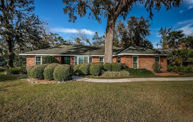 ranch-style home with a front yard