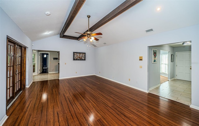 unfurnished living room featuring vaulted ceiling with beams, ceiling fan, and light hardwood / wood-style flooring