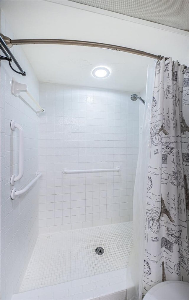 bathroom with a shower with curtain