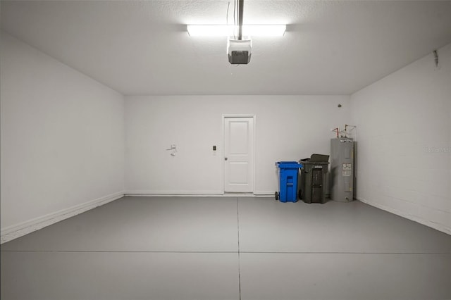 garage featuring a garage door opener and electric water heater