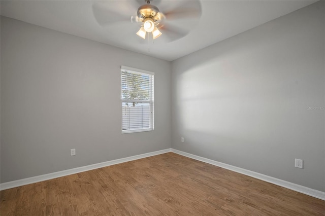 unfurnished room with hardwood / wood-style flooring and ceiling fan