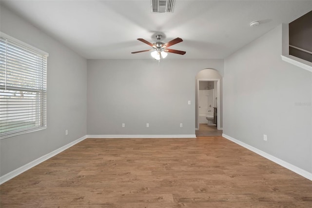 unfurnished room with ceiling fan and light wood-type flooring