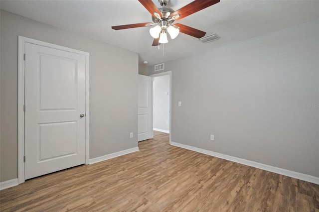 unfurnished bedroom featuring ceiling fan and light wood-type flooring