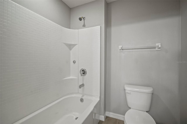 bathroom featuring bathing tub / shower combination and toilet