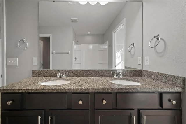 bathroom featuring vanity and walk in shower