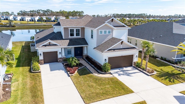 craftsman inspired home featuring a garage, a front lawn, and a water view