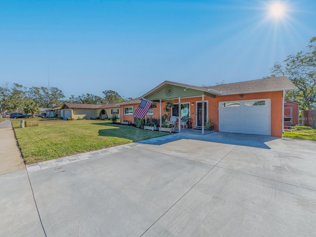 ranch-style house with a garage and a front yard