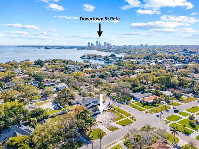 birds eye view of property featuring a residential view, a water view, and a city view