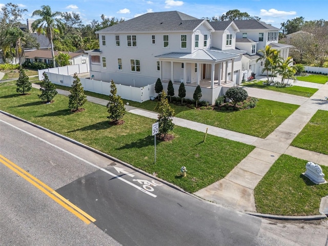 view of front of house with a front yard and a porch