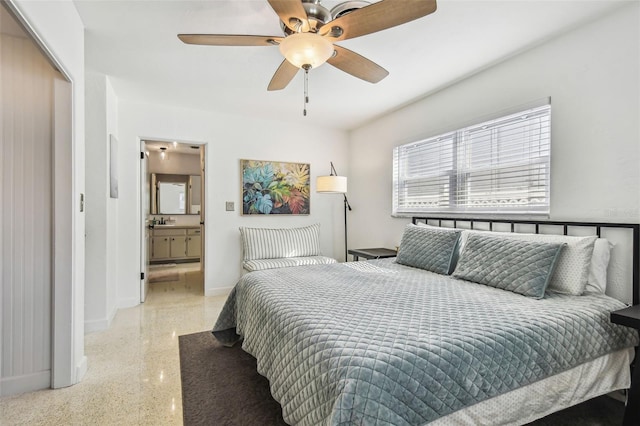 bedroom featuring ceiling fan, ensuite bathroom, and a closet