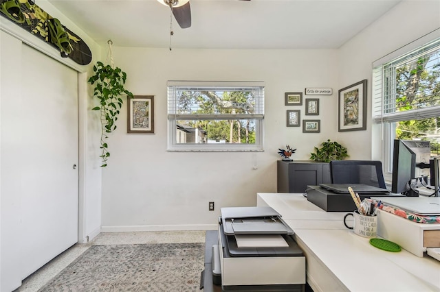 office area featuring plenty of natural light and ceiling fan