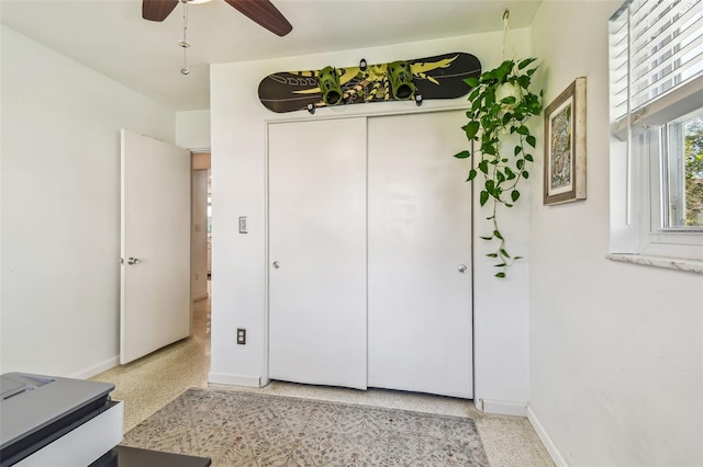 interior space featuring ceiling fan