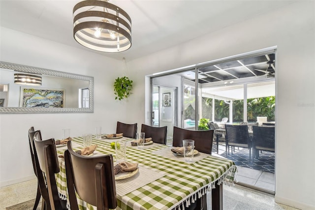 dining space featuring a notable chandelier