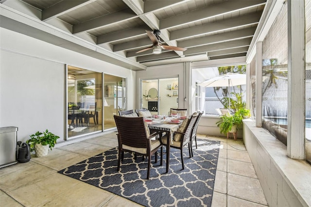 sunroom with beamed ceiling, wooden ceiling, and ceiling fan