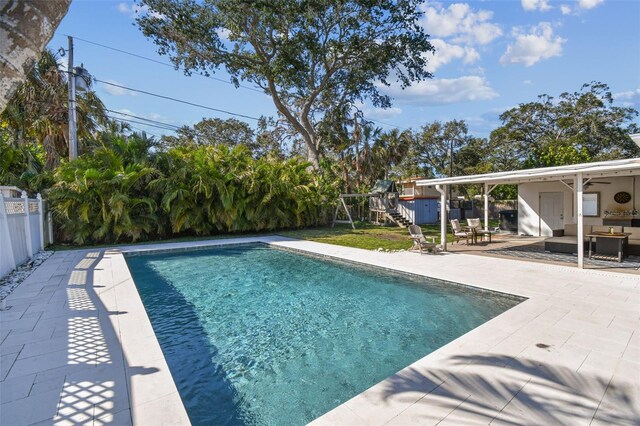 view of swimming pool with an outdoor living space and a patio area