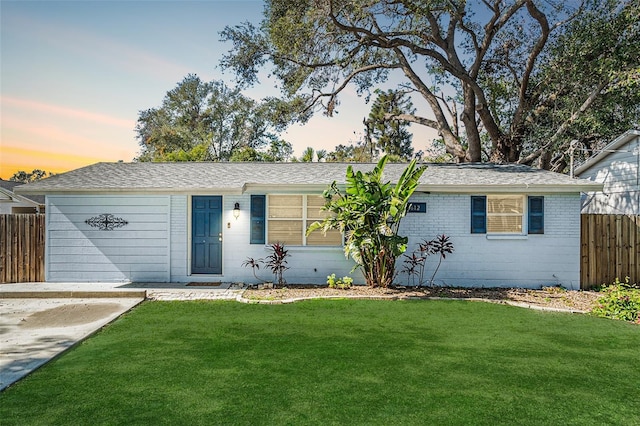 ranch-style house with a lawn