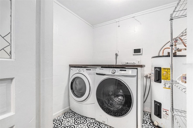 washroom featuring tile patterned flooring, washer and clothes dryer, electric water heater, and tile walls