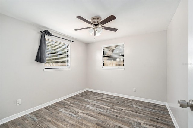 spare room with hardwood / wood-style flooring and ceiling fan