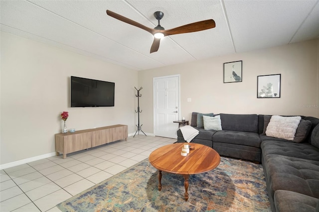 tiled living room featuring a textured ceiling and ceiling fan