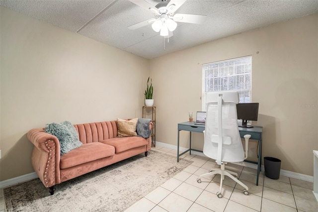 home office featuring light tile patterned floors, a textured ceiling, and ceiling fan