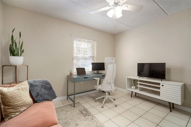 tiled office featuring ceiling fan and a textured ceiling