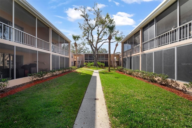 view of community featuring a yard