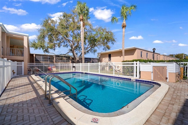 view of swimming pool featuring a patio