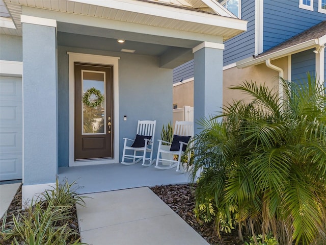 doorway to property featuring a porch