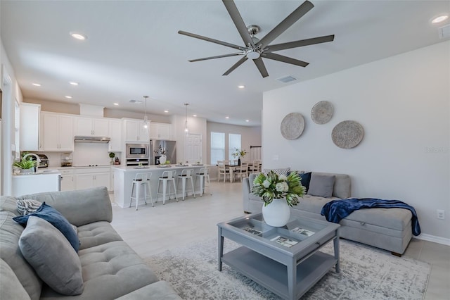 living room featuring ceiling fan