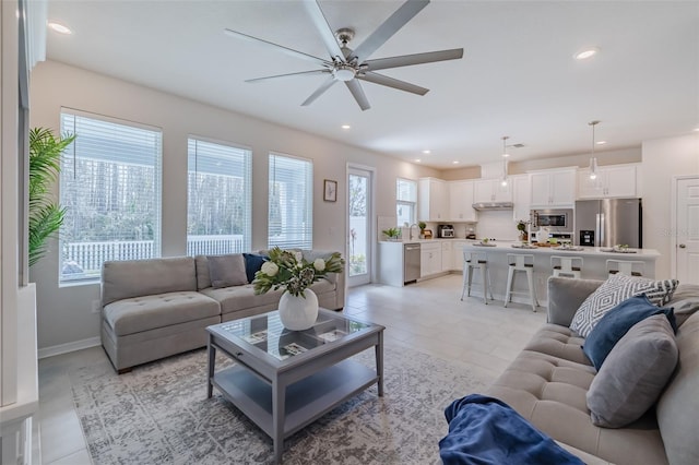 living room with sink and ceiling fan