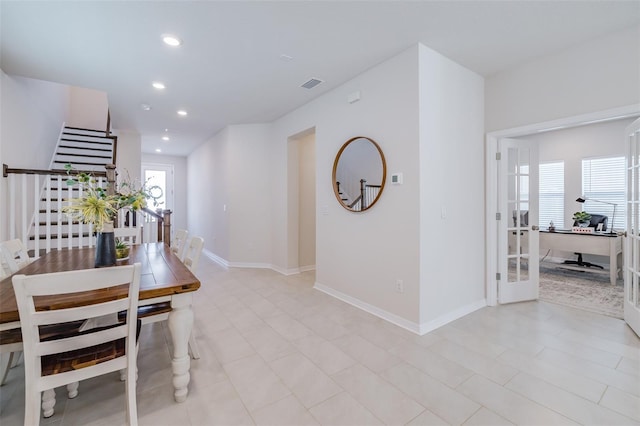 dining space with a healthy amount of sunlight and french doors