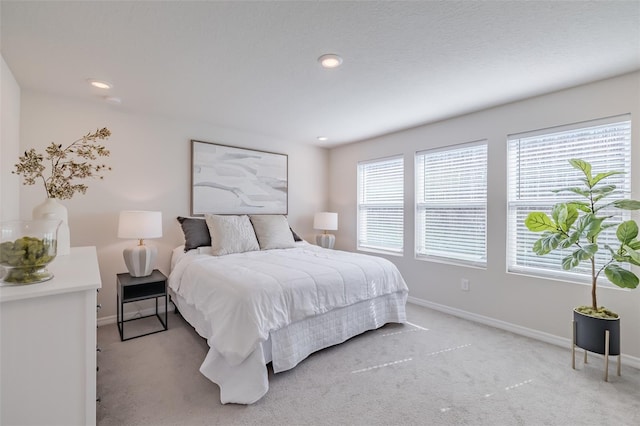 bedroom with light carpet