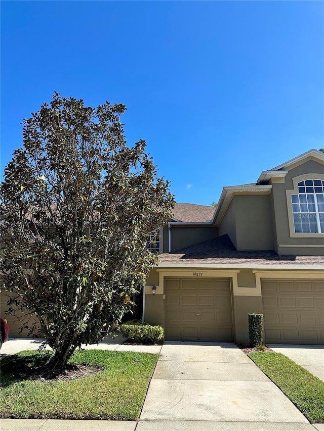 view of front of property with a garage